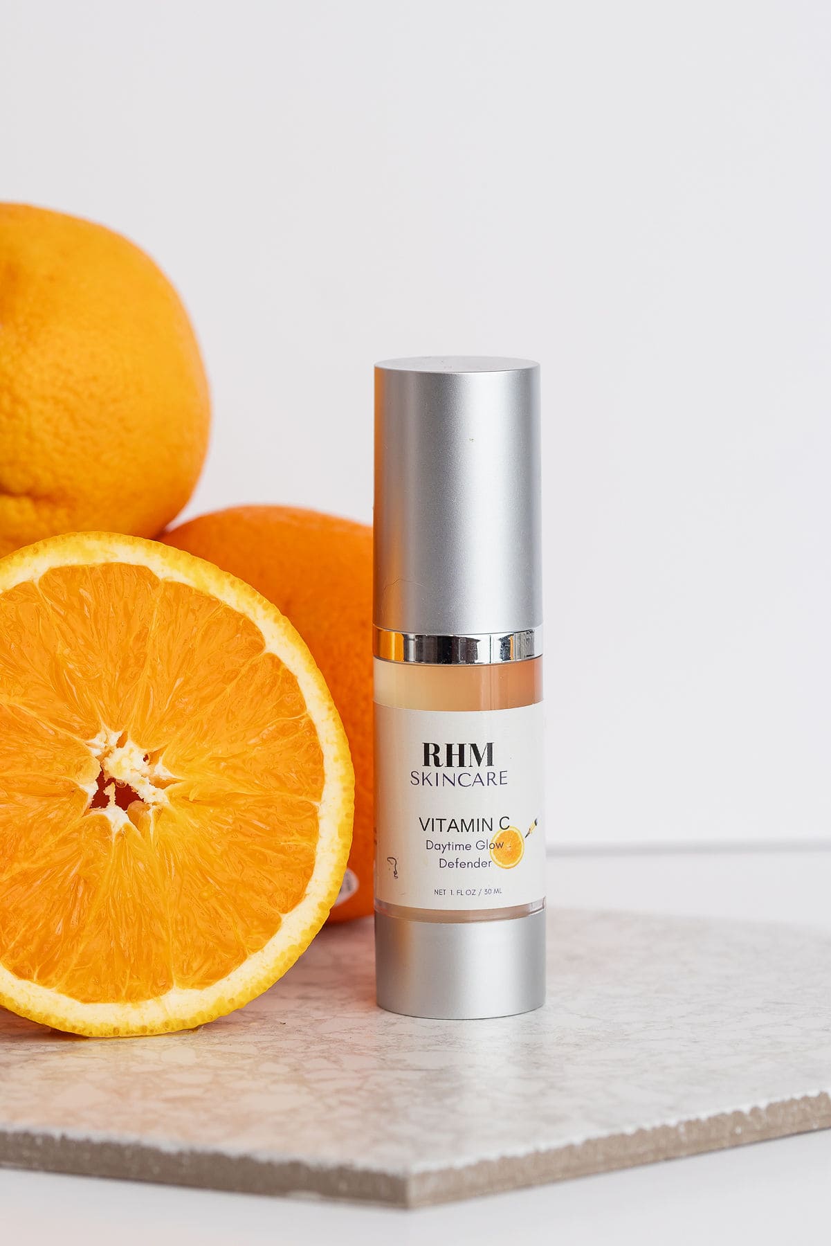 RHM Vitamin C Serum with fresh oranges